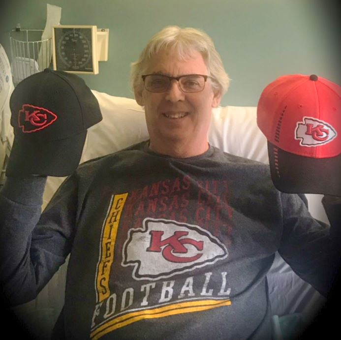 Pat Carey with his Chiefs hats for offense and defense