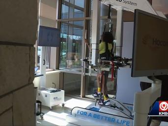 KMBC 9 abc. 91 degrees. 6:15. Woman utilizing robotic equipment as part of her rehabilitation.