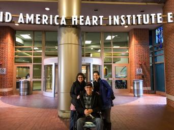 Pat Carey with his wife and daughter in front of Saint Luke's Mid America Heart Institute entrance