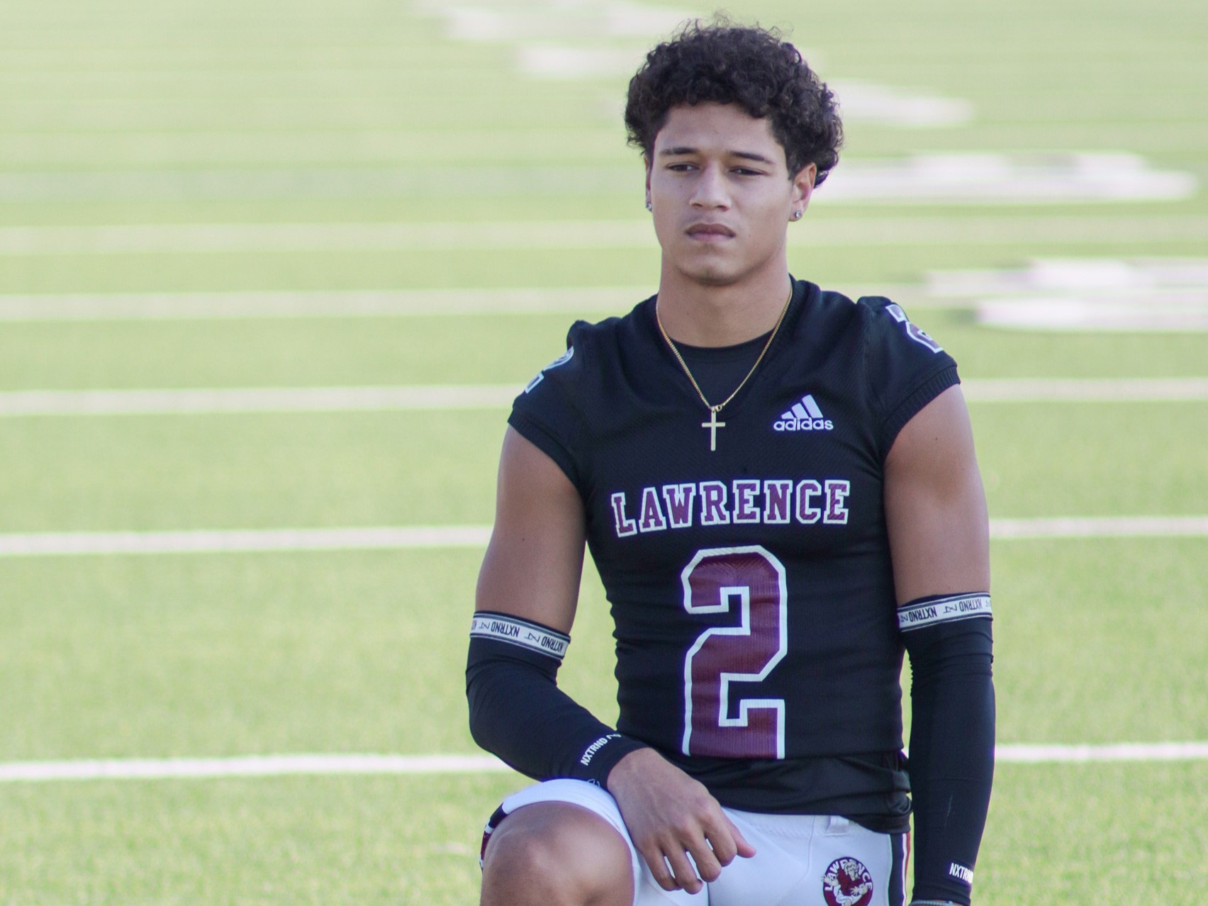 Jaylen on a football field. 
