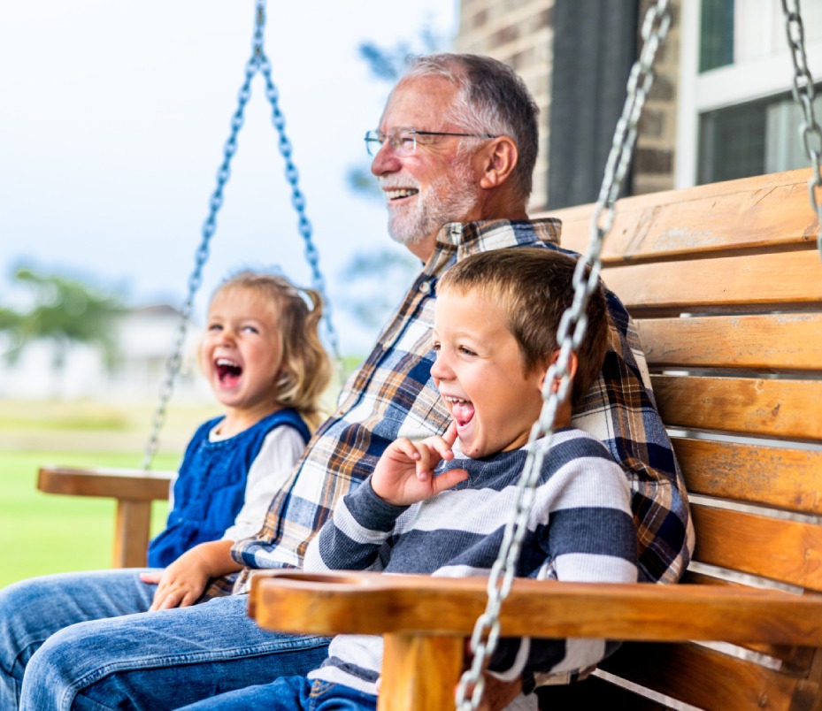 Smiling child with grandfather.