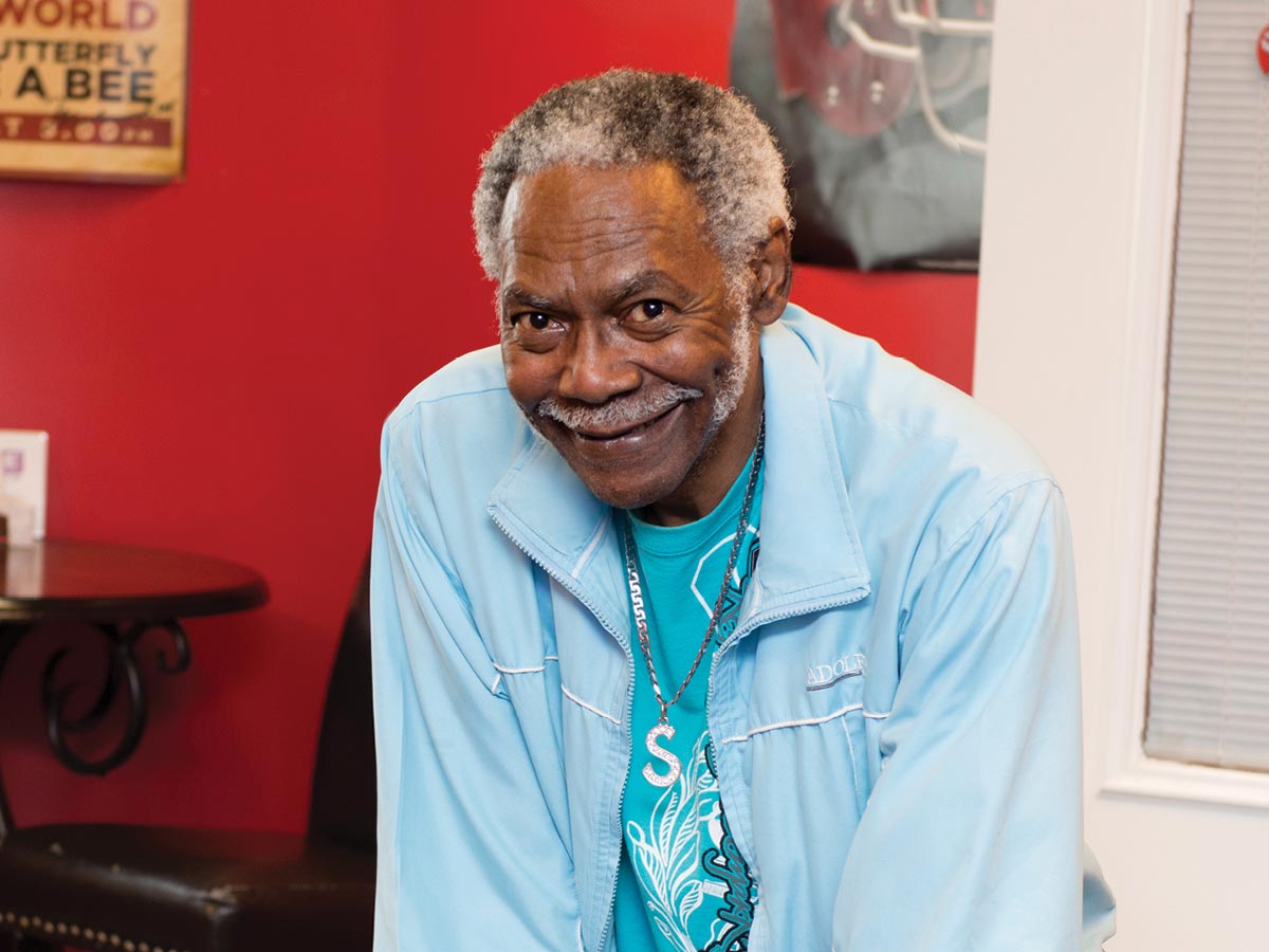 Candy Hunter stands next to a pool table
