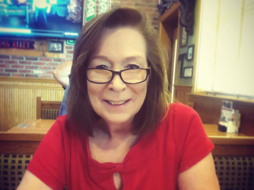 Rhonda Zacharias smiling at a restaurant