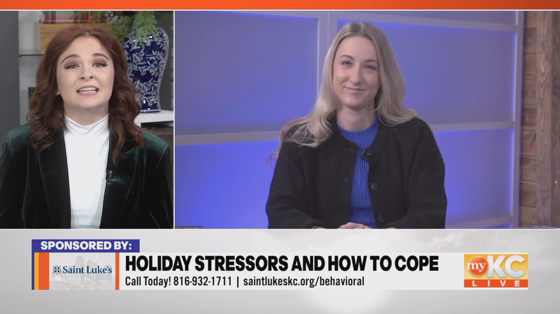 Physician with blonde hair and black blazer being interviewed by female reporter on myKC Live tv