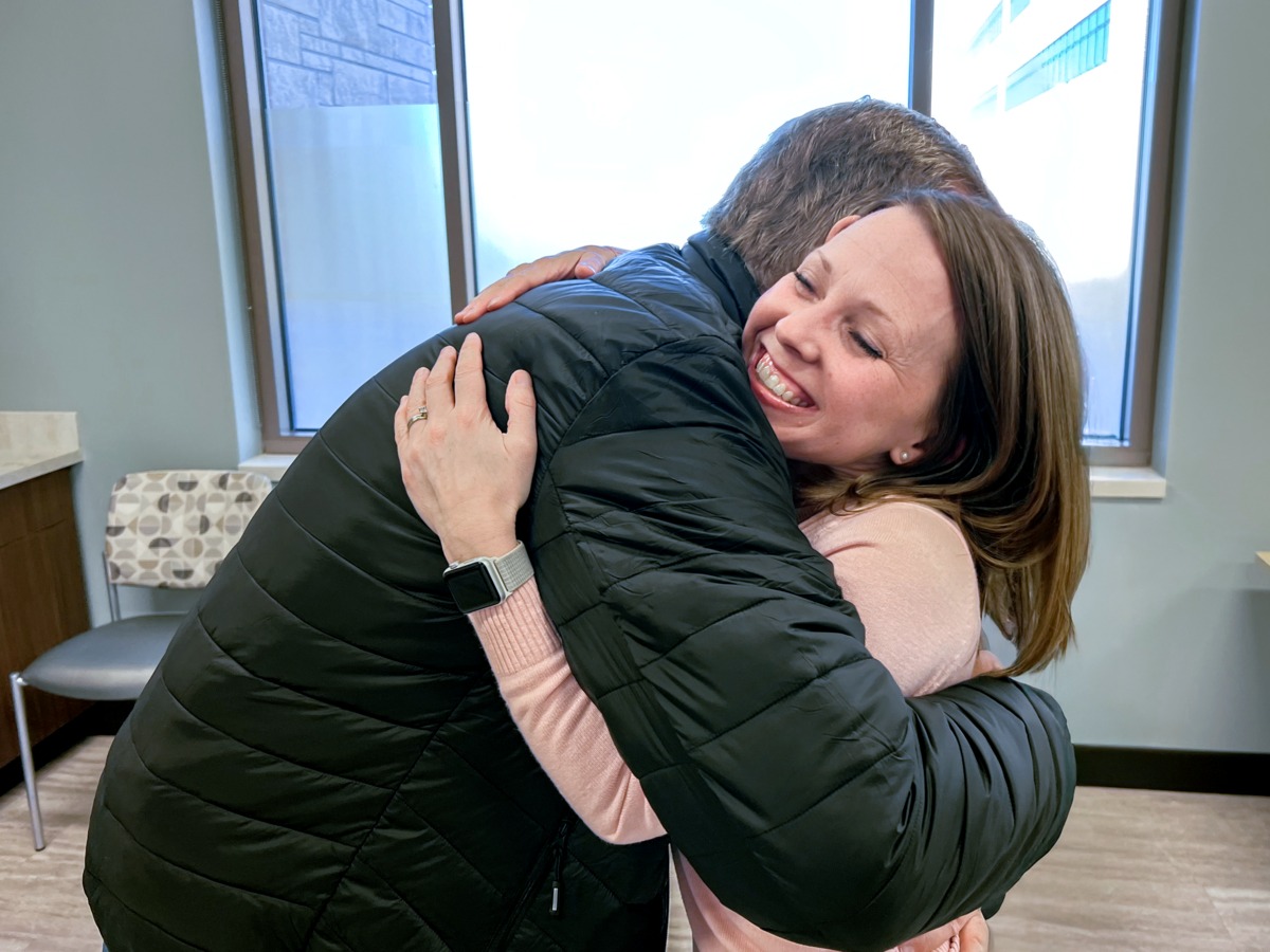Kevin hugs his music therapist Amy