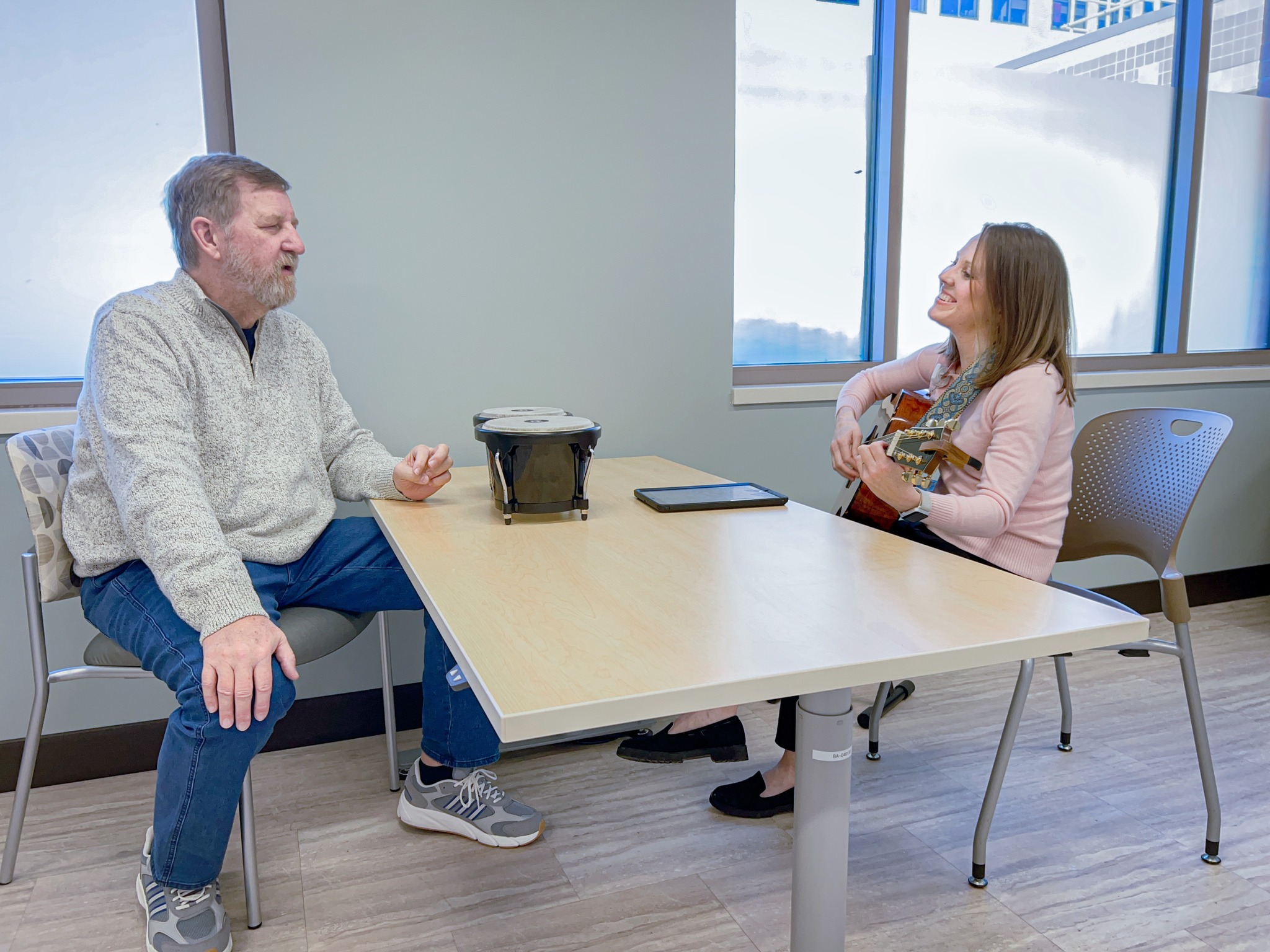 Kevin and Amy participate in a music therapy session